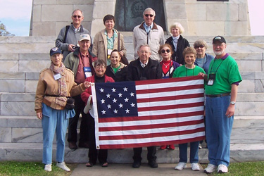 Group holding a 15-star and stripe flag